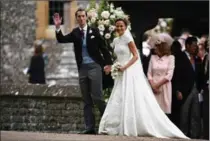  ?? WPA POOL, GETTY IMAGES ?? Pippa Middleton and her new husband James Matthews leave church following their wedding ceremony.