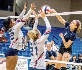  ?? Photo courtesy of JBU Sports Informatio­n ?? John Brown sophomore middle hitter Jessica Meyer hammers home a kill Saturday against Oklahoma Panhandle State in JBU’s 3-0 win at Bill George Arena.