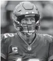  ?? KIM KLEMENT • USA TODAY SPORTS ?? Tampa Bay Buccaneers quarterbac­k Tom Brady looks on against the Atlanta Falcons during the second half at Raymond James Stadium on Sunday.