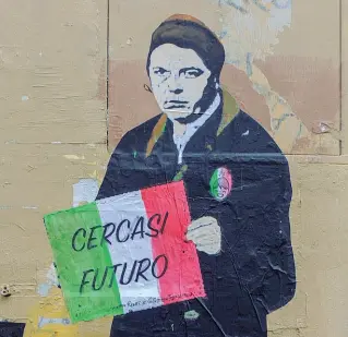 ??  ?? Il murales (poi cancellato) all’ingresso del parrucchie­re di Renzi a Firenze
