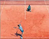  ?? GETTY IMAGES ?? Rohan Bopanna serves past partner Matwe Middelkoop against Marcelo Arevalo and Jean-julien Rojer on Thursday.