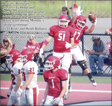  ?? Photo by Gerren Smith ?? Beavers’ Red team players...ty Hood and Cruz Gaytan pumped up after a touchdown score against the White team during Monday’s spring scrimmage....
Tyler Kratz and Heath Ballance with Lane Franks march toward the sideline after the big play....