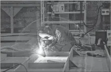  ?? TIM KROCHAK/SALTWIRE NETWORK ?? An employee welds steel into place while working on what will be the polar vessel Max Bernays, in the Assembly Hall at the Irving Shipyard in Halifax.