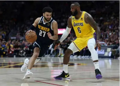  ?? AFP/VNA Photo ?? MURRAY'S MINT: Denver's Jamal Murray drives against Lebron James of the Los Angeles Lakers in the Nuggets' victory in game two of the NBA Western Conference finals.