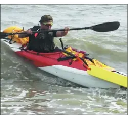  ?? PROVIDED TO CHINA DAILY ?? Zhen Shilun paddles his kayak along part of China’s 18,000 kilometers of coastline.