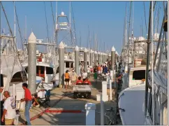  ??  ?? Some insurers will allow you to store your boat in the water at a marina — provided that the marina’s location and infrastruc­ture have demonstrat­ed a strong track record. City Marina in Charleston, South Carolina, which has invested deeply in tall,...