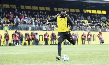  ?? Picture: BUNDESLIGA ?? HERE COMES A ROCKET: Usain Bolt shows off his skills during an open training session with Borussia Dortmund last Friday.