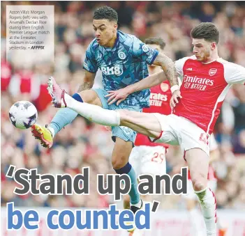  ?? – AFPPIX ?? Aston Villa’s Morgan Rogers (left) vies with Arsenal’s Declan Rice during their English Premier League match at the Emirates Stadium in London yesterday.