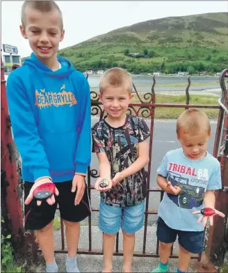  ??  ?? Michael, Jack and James Innes with their finds.