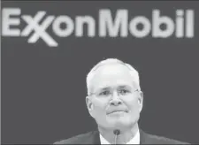  ??  ?? FILE PHOTO: Darren Woods, Chairman & CEO, Exxon Mobil Corporatio­n attends a news conference at the NYSE