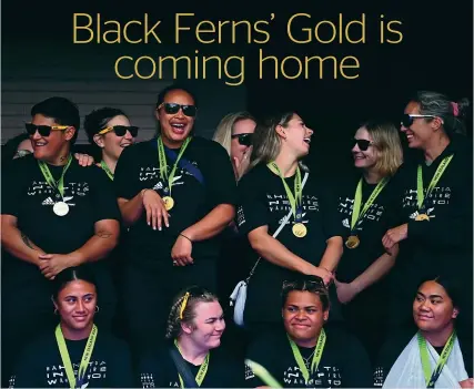  ?? GETTY ?? Black Ferns Amy du Plessis, third from the left standing, and Amy Rule, second from left sitting, plan to visit their home province of Southland before the end of the year and bring their World Cup winning medals with them.