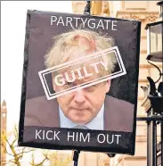  ?? AFP ?? A placard calling for the resignatio­n of Britain's Prime Minister at a protest outside the entrance to 10 Downing Street, London.