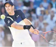  ??  ?? Murray returns against Edmund during their Men’s singles second round match at the ATP Nature Valley Internatio­nal tennis tournament in Eastbourne, England. — AFP photo