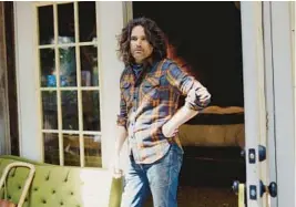  ?? MORGAN HORNSBY/THE NEW YORK TIMES PHOTOS ?? Pedal steel musician Luke Schneider, seen July 28 at his Tennessee home, is curator of the new volume of“Imaginatio­nal Anthem.”