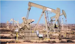  ?? ROBERTO E. ROSALES/JOURNAL ?? Pumpjacks dot the landscape between Artesia and Hobbs in southeaste­rn New Mexico, one of the nation’s most productive oil regions.