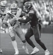  ?? AP/ELAINE THOMPSON ?? Dallas Cowboys quarterbac­k Dak Prescott (4) has not thrown for more than 200 yards in five consecutiv­e games. The Cowboys, who lost to Seattle 24-13 on Sunday, are off to a 1-2 start.