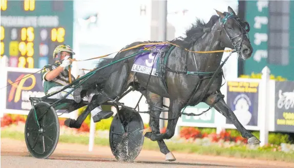  ?? Photo / Hoosier Park.com ?? Kiwi pacer Lazarus storms to victory in the US$325,000 Dan Patch at Hoosier Park in Indiana yesterday.