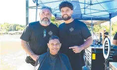  ?? Picture: Isaac McCarthy ?? Rob Hodge with Fresh Start Academy barber trainee Feao Tongia, 21, and Sidsulai Ingui, 15, in the chair.