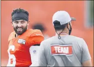  ??  ?? RON SCHWANE — THE ASSOCIATED PRESS Browns quarterbac­k Baker Mayfield talks with head coach Kevin Stefanski during practice Aug. 24in Berea.