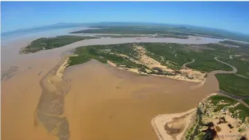  ??  ?? Sediment-filled water is seen at the mouth of the Burdekin River in Queensland, Australia in this picture obtained from social media. — Reuters photo