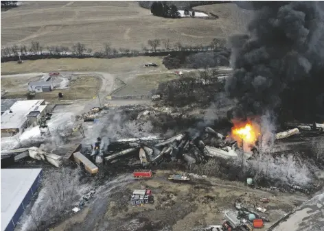  ?? AP PHOTO/GENE J. PUSKAR ?? This photo taken with a drone shows portions of a Norfolk and Southern freight train that derailed Friday night in East Palestine, Ohio are still on fire at mid-day on Saturday.