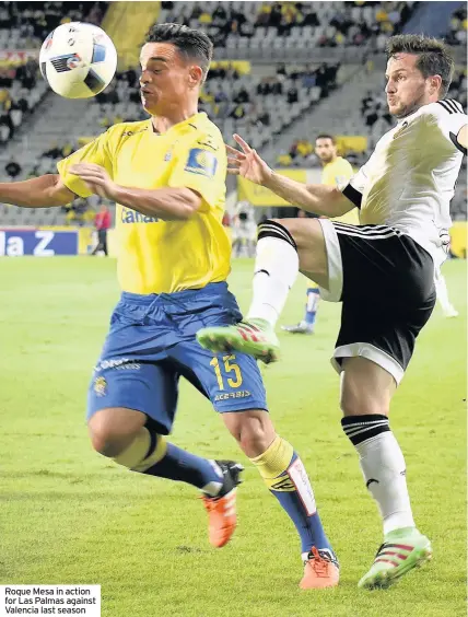  ??  ?? Roque Mesa in action for Las Palmas against Valencia last season