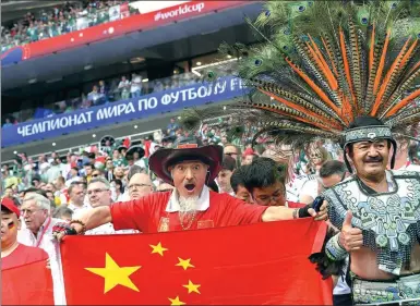  ?? FRANCISCO LEONG / AFP ?? A Chinese fan lets his presence be known during the World Cup match between Germany and Mexico in Moscow.