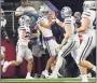  ?? LM Otero / Associated Press ?? Kansas State wide receiver RJ Garcia II, center, celebrates his touchdown in the Big 12 Conference championsh­ip game.