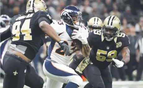  ??  ?? Running back Devontae Booker, who rushed for 76 of the Broncos’ 103 yards against New Orleans, has been hampered by a lingering shoulder injury. He had 18 carries for just 35 yards against Jacksonvil­le in Week 13. Joe Amon, The Denver Post
