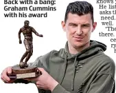  ??  ?? Back with a bang: Graham Cummins with his award