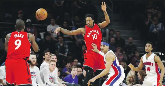  ?? GREGORY SHAMUS/ GETTY IMAGES ?? Raptor DeMar DeRozan, middle, has become more of a ball-distributo­r after enduring frequent double- and triple-team defences in Kyle Lowry’s absence.