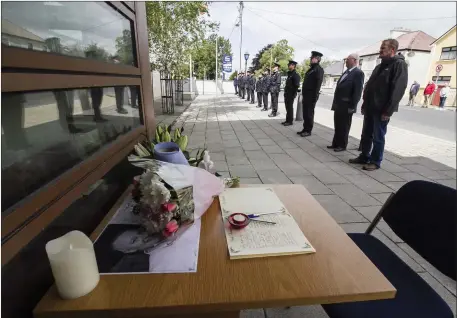  ?? Picture: John Reidy ?? A book of condolence­s and floral tributes as serving and retired members of the force join to pay tribute to their fallen colleague, Detective Garda Coln Horkan, at Castleisla­nd Garda Station as his Funeral service was being conducted in County Mayo.