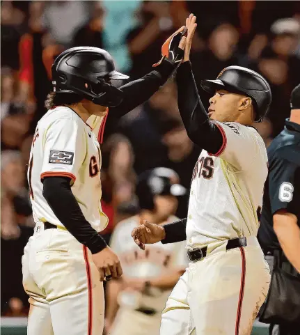  ?? Carlos Avila Gonzalez/The Chronicle ?? LaMonte Wade Jr., right, is a career .184 hitter against lefties, which has left the first baseman/outfielder in a platoon role.