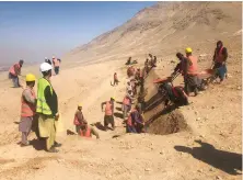  ?? Supplied ?? Laborers dig trenches in Kabul for the storage of water. To overcome a water shortage in Afghanista­n and to replenish its groundwate­r resources, the government has begun building 1.9 million ditches and 26 small dams.