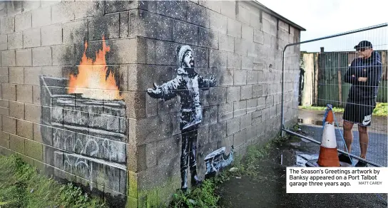  ?? MATT CARDY ?? The Season’s Greetings artwork by Banksy appeared on a Port Talbot garage three years ago.
