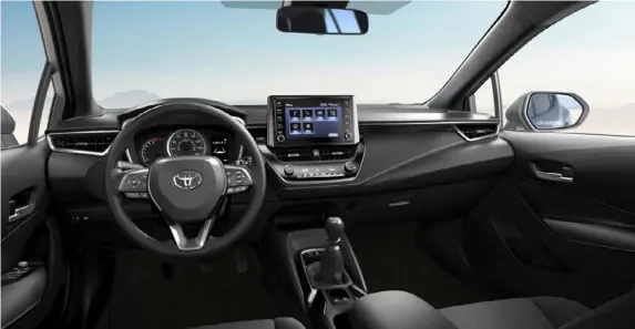  ?? ?? The 2022 Toyota Corolla Hatchback offers seats far more comfortabl­e than the price would suggest, and a nice looking dashboard as well. Rear seat passengers will be either short or sad. Below, the hatchback might draw some notice in electric blue, but otherwise it’s designed to blend in.
