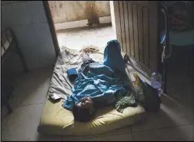  ?? AP PHOTO ?? Abdul Karim lies on the floor at Sadar Hospital in Cox’s Bazar, Bangladesh. Karim sustained severely bullet injuries on his left foot and chest when Myanmar monks and soldiers attacked his village.