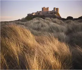  ?? ?? STATELY. Bamburgh Castle in Northumber­land, England.