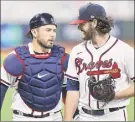  ?? Elsa / Getty Images ?? Ian Anderson, right, said catcher Travis d’arnaud has been vital in him doing so well this postseason.