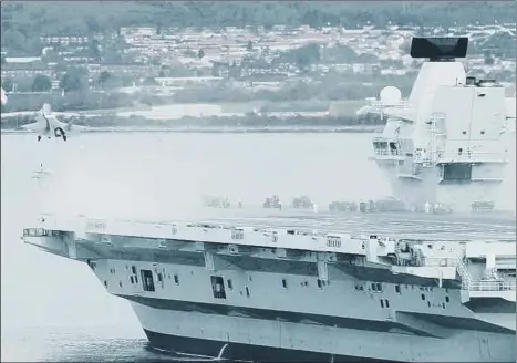  ?? Picture: Chris Moorhouse ?? HISTORY IN THE MAKING The F-35 taking off the flight deck of HMS Queen Elizabeth in Portsmouth