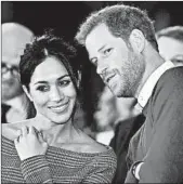  ?? BEN BIRCHALL/GETTY-AFP ?? Britain’s Prince Harry and fiancee Meghan Markle watch a dance performanc­e in Wales last month.
