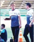  ?? AFP ?? Cambodia coach Keisuke Honda (left) takes a training session at Olympic Stadium on Tuesday.