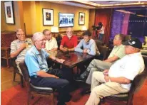  ?? AP PHOTO/ADRIAN SAINZ ?? Seven of the 11 Davis brothers — Eddie, Frederick, Arguster, Octavious, Nathaniel, Julius and Lebronze — chat during a reunion at a hotel-casino on July 12 in Tunica, Miss.