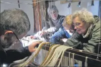  ??  ?? Volunteer weavers were pictured warping up Hope MacDougall’s 19th- century loom.