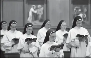  ??  ?? Sisters sing at the Dominican Sisters of Mary, Mother of the Eucharist chapel in Ann Arbor, Mich. The nuns are part of a 130-member Catholic order with a third album titled Jesu, Joy of Man’s Desiring: Christmas With the Dominican Sisters of Mary.