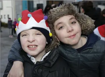  ??  ?? David and Jordan Keddy at the switching on of the Christmas lights at Bray Civic Plaza.