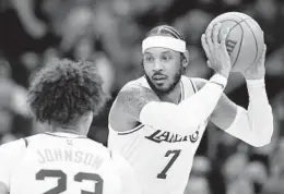  ?? CHRISTIAN PETERSEN GETTY IMAGES ?? Lakers’ Carmelo Anthony, who had eight points on 4-of-10 shooting, handles the ball during the first half of a preseason game against the Phoenix Suns.