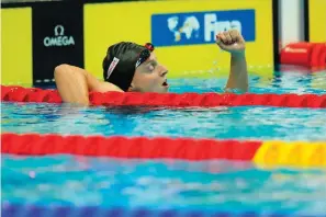  ?? The Associated Press ?? ■ Katie Ledecky, of the United States, celebrates after finishing first in the women’s 400m freestyle final at the 19th FINA World Championsh­ips in Budapest, Hungary, Saturday.