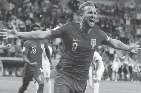  ?? THANASSIS STAVRAKIS / THE ASSOCIATED PRESS ?? Harry Kane celebrates after scoring what proved to be the game-winner in Monday’s 2-1 victory over Tunisia at the World Cup in Russia.