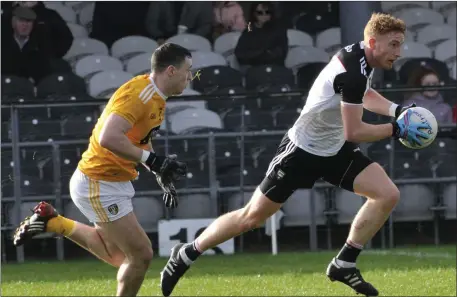  ??  ?? Sligo’s Sean Carrabine leaps away from his opponent in the Allianz league Division 4 game in Markievicz Park on Sunday. Pic: Carl Brennan.